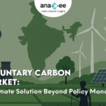 Illustration showing India's map alongside wind turbines, solar panels, factories emitting CO2, and a rural figure, symbolizing the transition from carbon emissions to clean energy through the Voluntary Carbon Market.