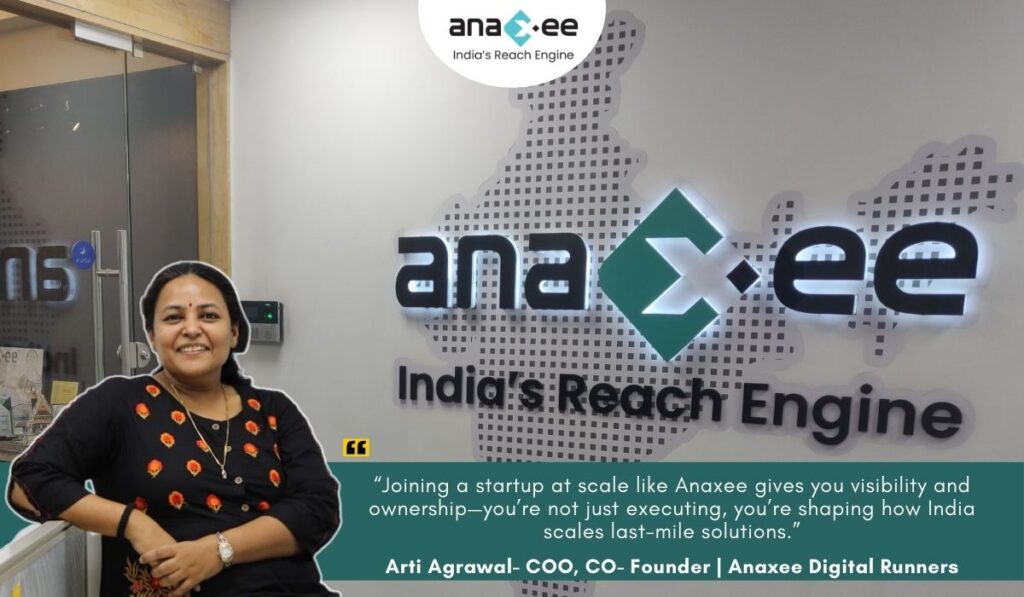 Arti Agrawal, COO and Co-Founder of Anaxee Digital Runners, at the company office with the Anaxee logo and a leadership quote about scaling last-mile solutions in India.
