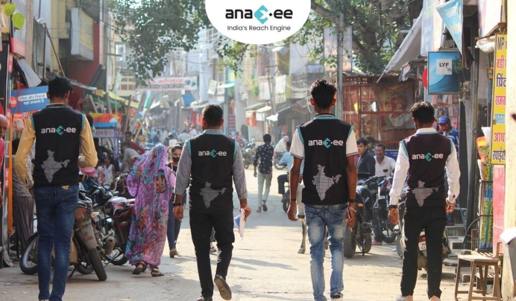 Anaxee Digital Runners walking through a crowded Indian market during a large-scale on-ground voter engagement campaign.