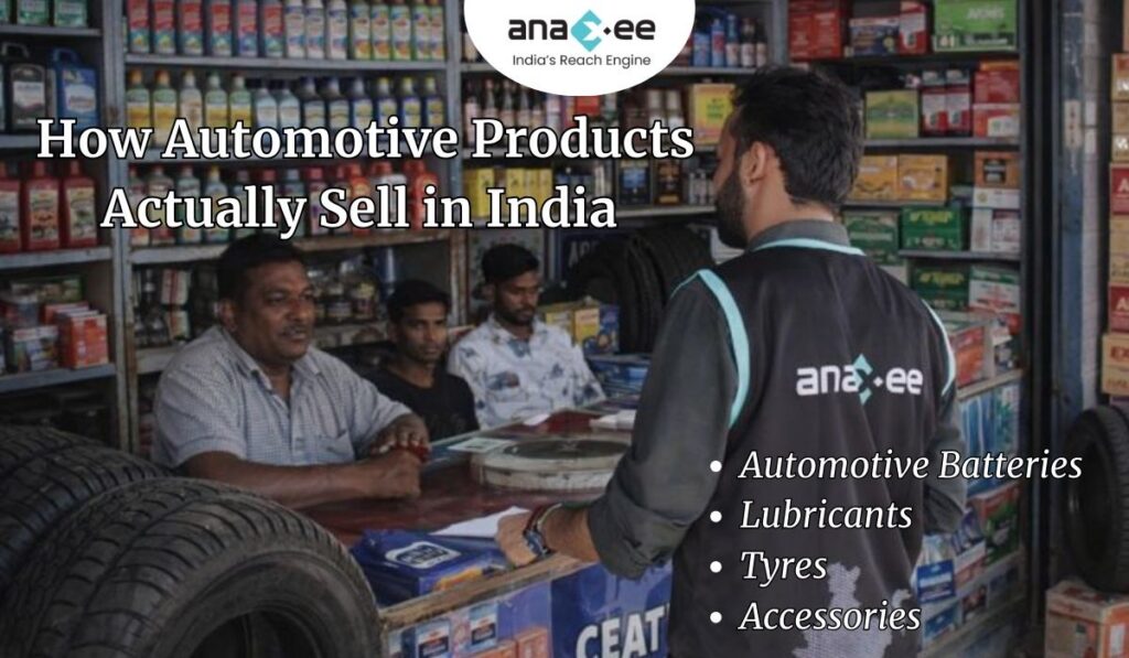 Anaxee field executive engaging with an automotive retailer inside a shop selling tyres, lubricants, batteries, and accessories in India