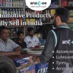 Anaxee field executive engaging with an automotive retailer inside a shop selling tyres, lubricants, batteries, and accessories in India