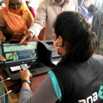Anaxee Digital Runner helping a villager register on CoWIN in rural India